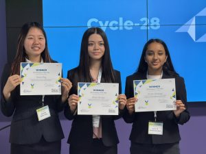 Cycle-28's 3 team members hold up their certificate's as winners of JA Company program