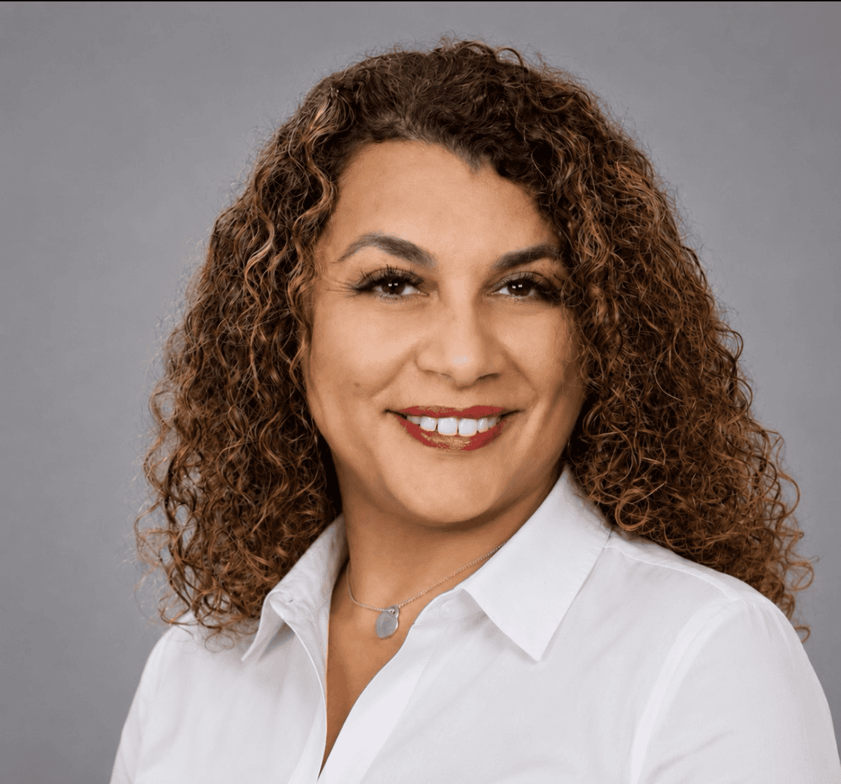 Image is a headshot photo of staff member